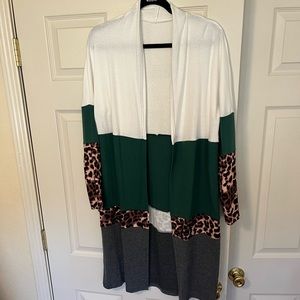 Beautiful hunter green color blocked cardigan. Light weight